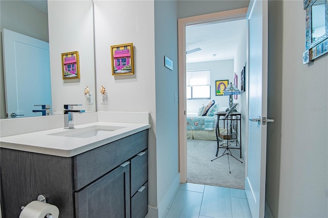 bathroom featuring baseboards and vanity