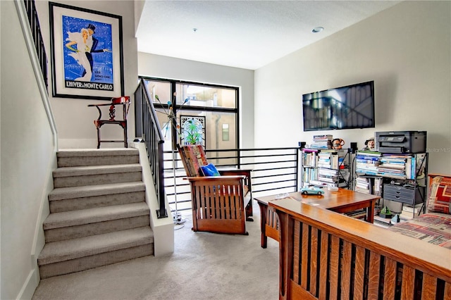 interior space featuring carpet floors and baseboards