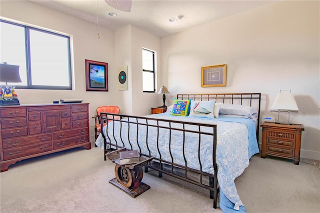 bedroom with recessed lighting, baseboards, and light colored carpet