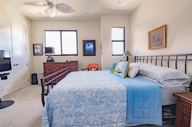 carpeted bedroom featuring a ceiling fan and recessed lighting