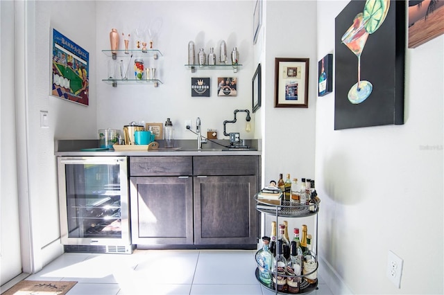 bar with a sink, beverage cooler, and indoor wet bar