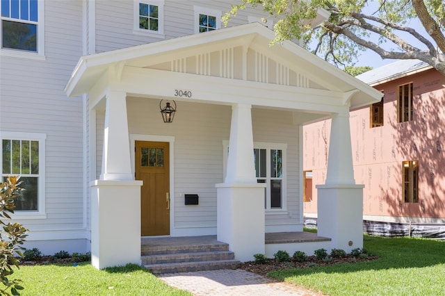 doorway to property featuring covered porch