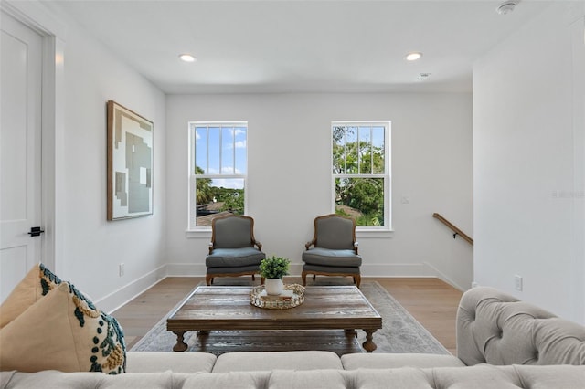 living room featuring recessed lighting, light wood-style flooring, and baseboards