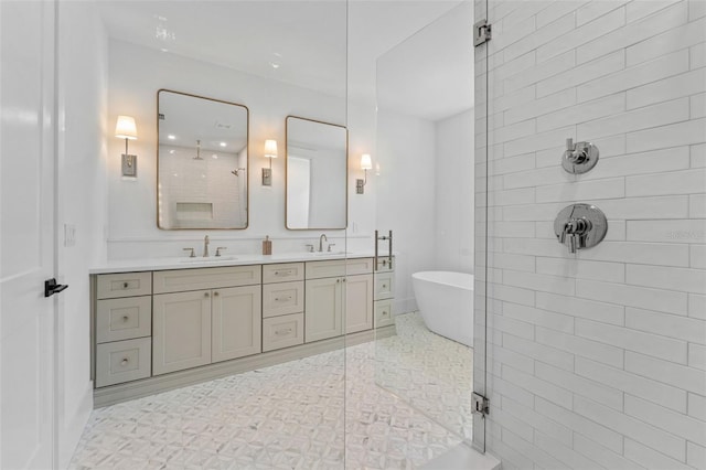 full bathroom featuring a stall shower, a sink, and double vanity