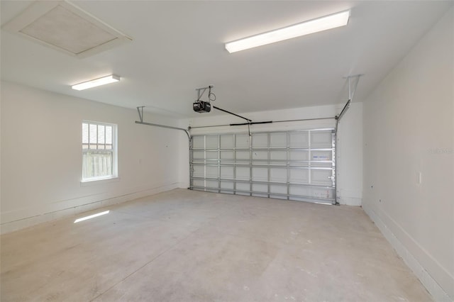 garage featuring baseboards and a garage door opener