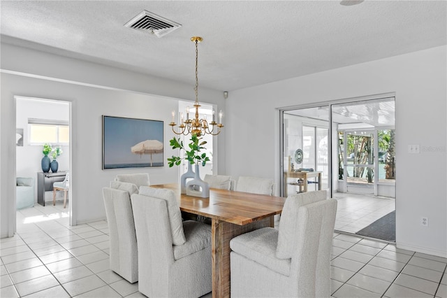 dining room with visible vents, plenty of natural light, and light tile patterned flooring