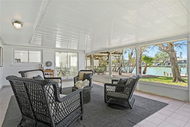 sunroom with a water view and plenty of natural light