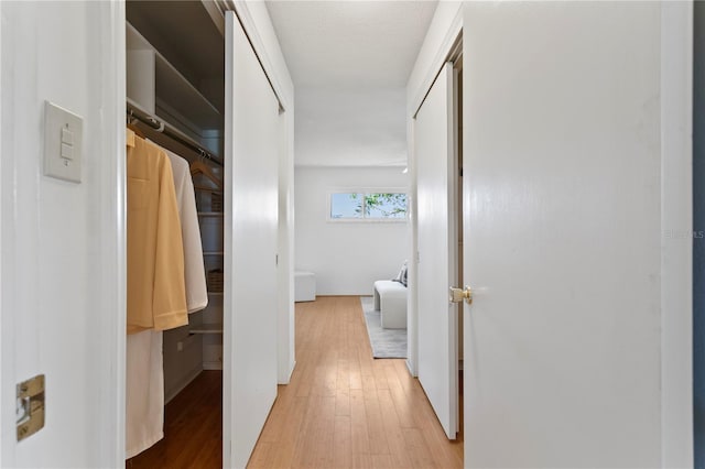 hallway with wood finished floors