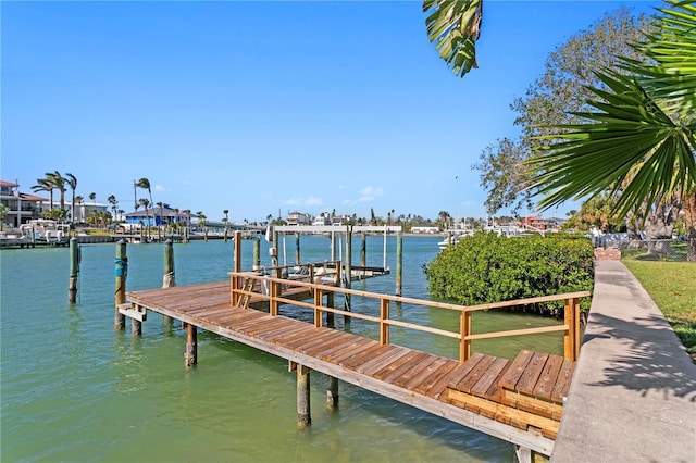 view of dock featuring a water view and boat lift