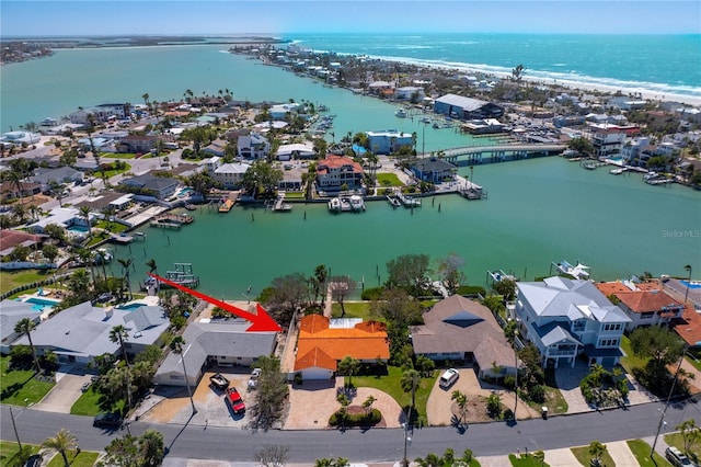 drone / aerial view featuring a water view and a residential view