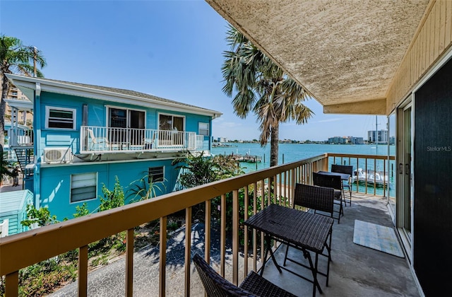 balcony featuring a water view