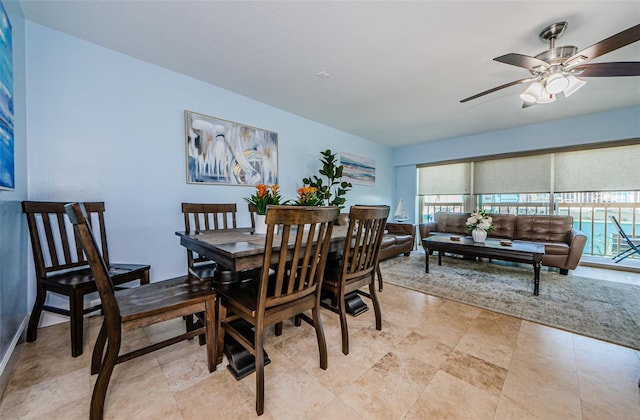 dining space featuring ceiling fan