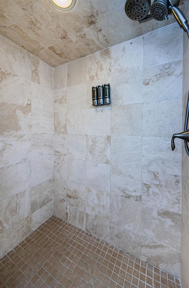 bathroom with a tile shower