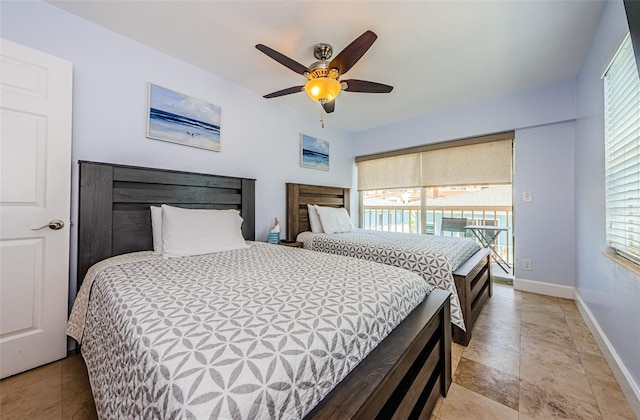 bedroom with baseboards and a ceiling fan