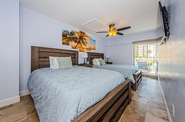 bedroom with a ceiling fan and baseboards