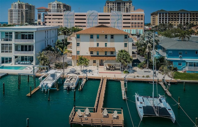 exterior space with a water view and a city view