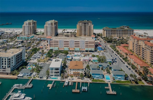 birds eye view of property featuring a water view and a view of city