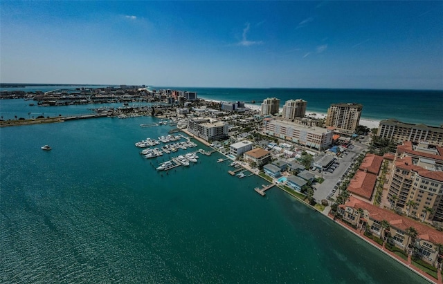 birds eye view of property with a view of city and a water view