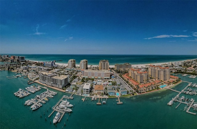 drone / aerial view featuring a view of city and a water view