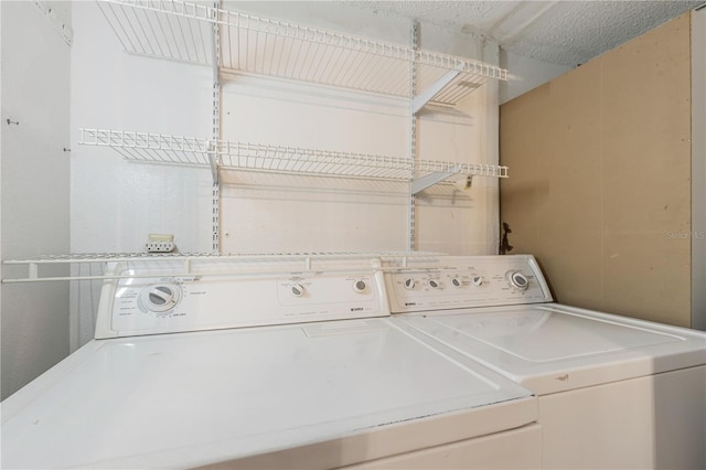 washroom with laundry area and washer and dryer