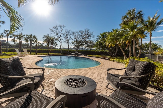 view of swimming pool with a patio area, a fenced in pool, an outdoor hangout area, and fence