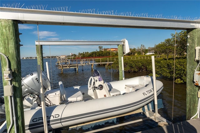 view of dock with a water view and boat lift