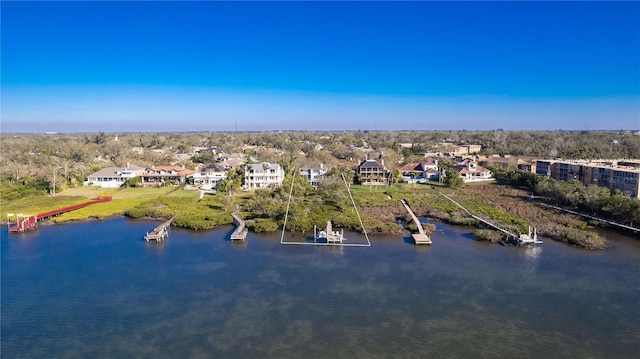 drone / aerial view featuring a water view and a residential view