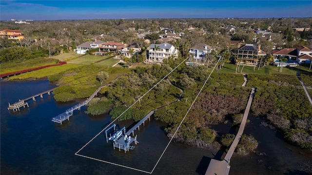 bird's eye view with a residential view and a water view