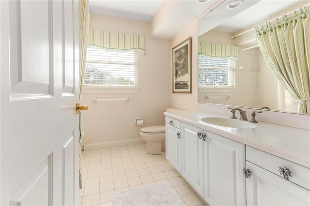 12808 Harborwood Dr, Largo, FL 33774 - full bathroom with tile patterned floors, toilet, curtained shower, baseboards, and vanity