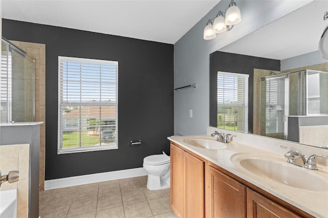 bathroom featuring a sink, a shower stall, and tile patterned flooring