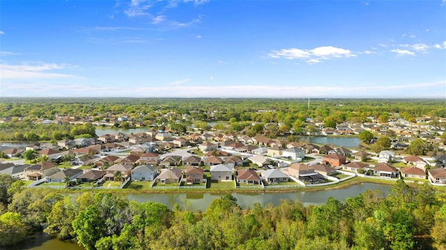 drone / aerial view with a residential view and a water view