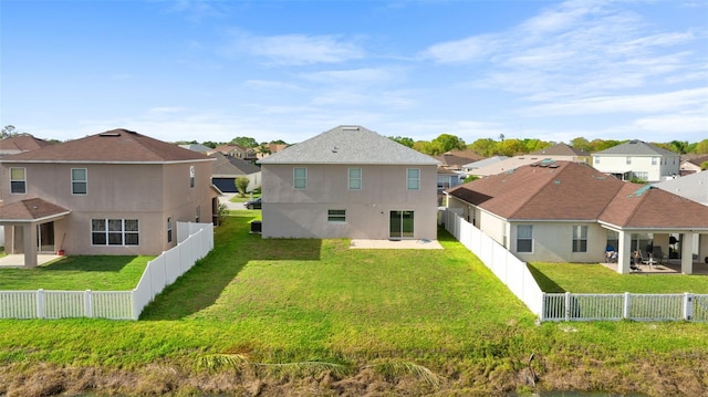 rear view of house with a patio, a fenced backyard, a residential view, and stucco siding