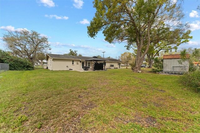 view of yard featuring a patio area and fence