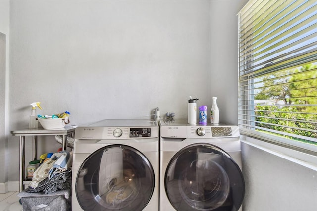 laundry room with washing machine and clothes dryer and laundry area