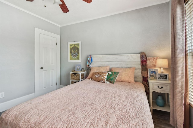 bedroom featuring ceiling fan, wood finished floors, baseboards, and ornamental molding