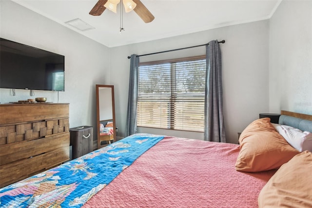 bedroom featuring crown molding and a ceiling fan