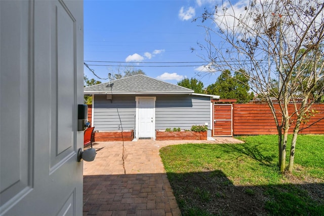 view of yard with a patio area, a gate, and fence