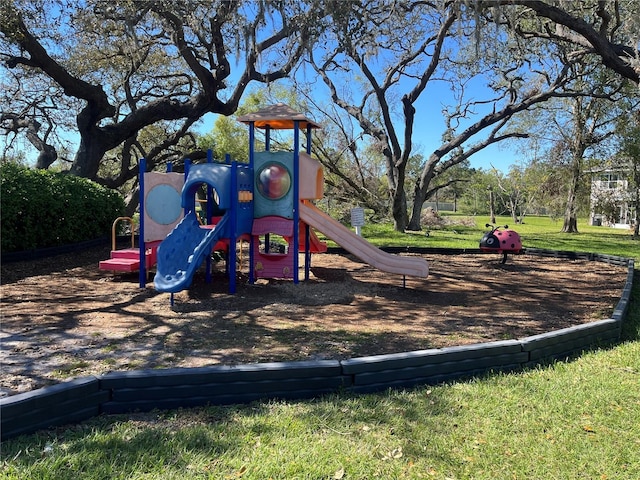 community jungle gym featuring a yard