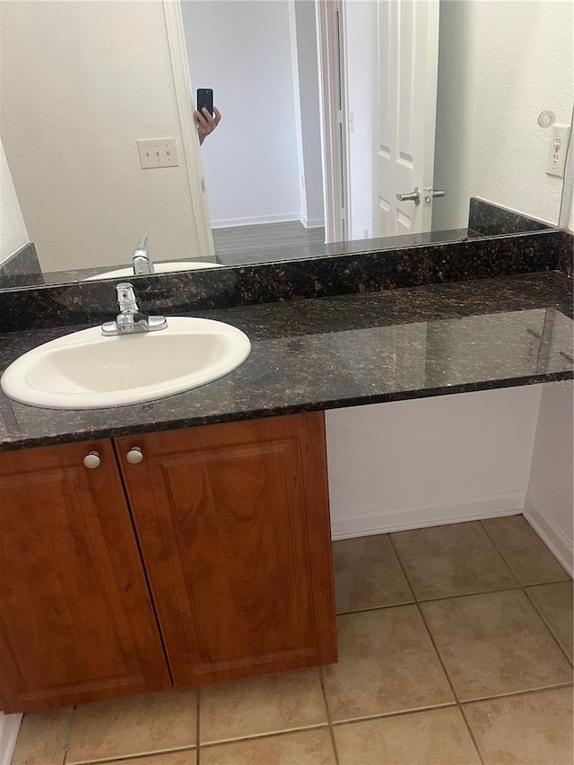 bathroom with vanity and tile patterned floors