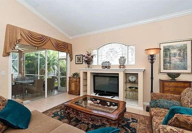 tiled living room with ornamental molding and a glass covered fireplace