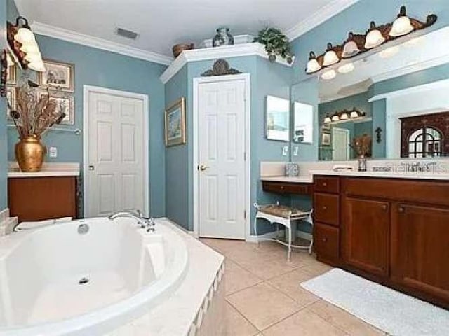 bathroom with a garden tub, visible vents, ornamental molding, vanity, and tile patterned floors