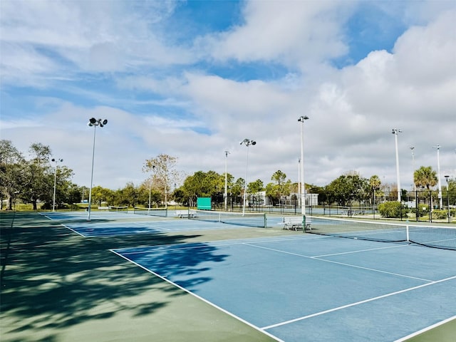 view of sport court with fence