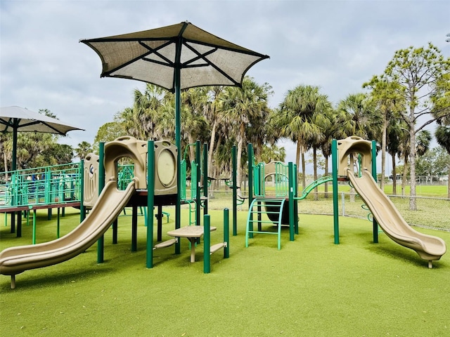 community play area featuring a lawn