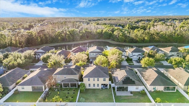 bird's eye view featuring a residential view and a wooded view