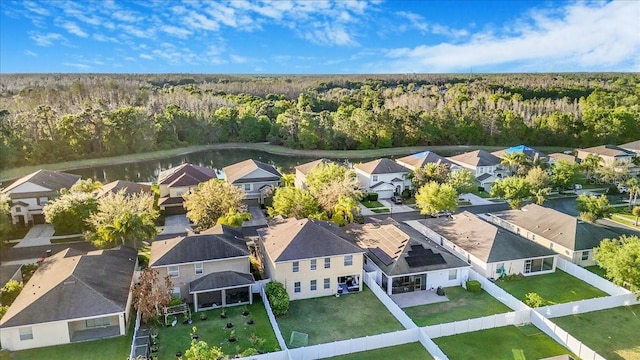 aerial view featuring a view of trees and a residential view