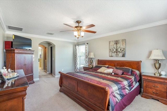 bedroom with arched walkways, visible vents, light carpet, and ornamental molding
