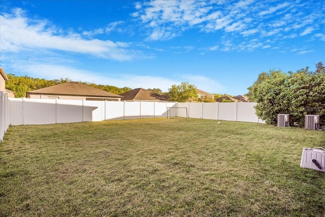 view of yard featuring cooling unit and a fenced backyard