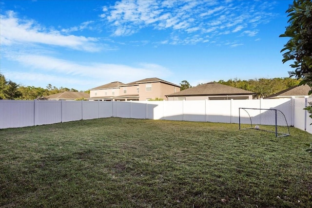 view of yard with a fenced backyard