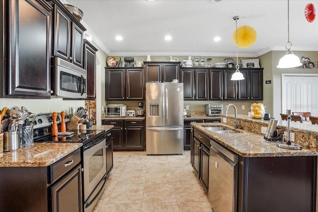 kitchen featuring light tile patterned flooring, ornamental molding, a sink, appliances with stainless steel finishes, and pendant lighting