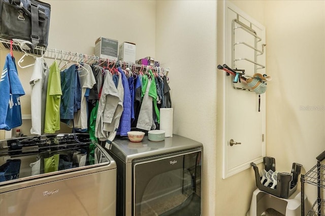washroom featuring separate washer and dryer and laundry area